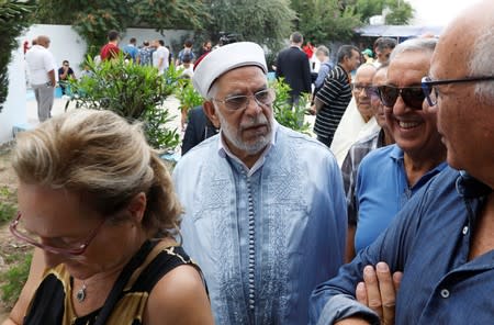 Abdelfattah Mourou, vice president of the moderate Islamist Ennahda party and presidential candidate, stands outside a polling station during presidential election in Tunis