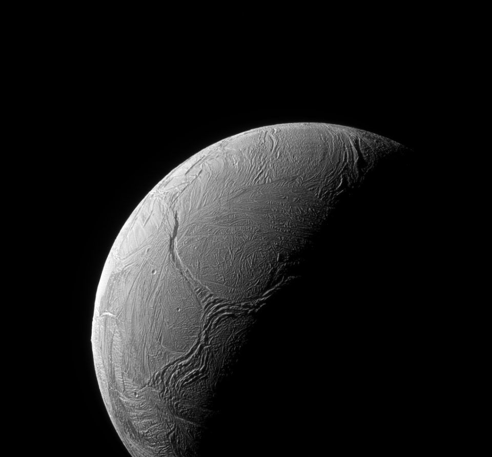 A sinuous feature snakes northward from the north pole of Saturn's sixth biggest moon, Enceladus, like a giant tentacle on Feb. 15, 2016.