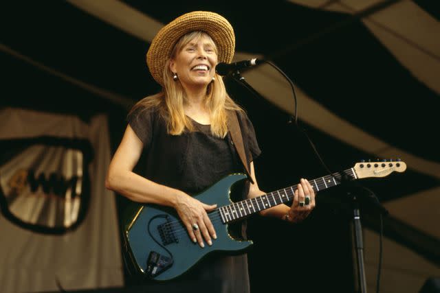 David Redfern/Redferns Joni Mitchell at the 1995 New Orleans Jazz and Heritage Festival