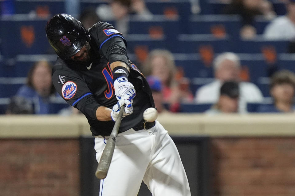 New York Mets' J.D. Martinez hits a two-run home run during the sixth inning of a baseball game against the Arizona Diamondbacks, Friday, May 31, 2024, in New York. (AP Photo/Frank Franklin II)