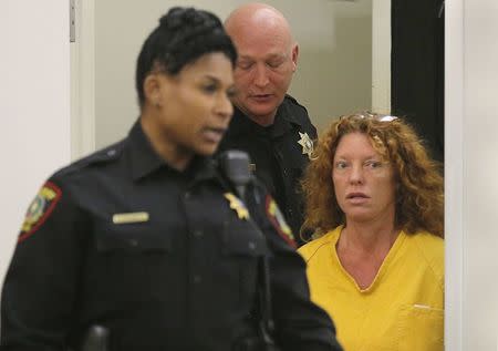 Tonya Couch (R) enters the courtroom to appear before state District Judge Wayne Salvant in Fort Worth, Texas, January 8, 2016. REUTERS/Rodger Mallison/Fort Worth Star-Telegram/Pool