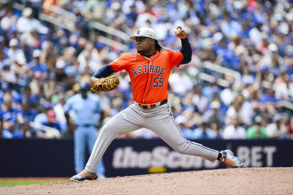 Houston Astros pitcher Framber Valdez (59) throws during the second inning of a baseball game against the Toronto Blue Jays in Toronto on Thursday, July 4, 2024. (Christopher Katsarov/The Canadian Press via AP)