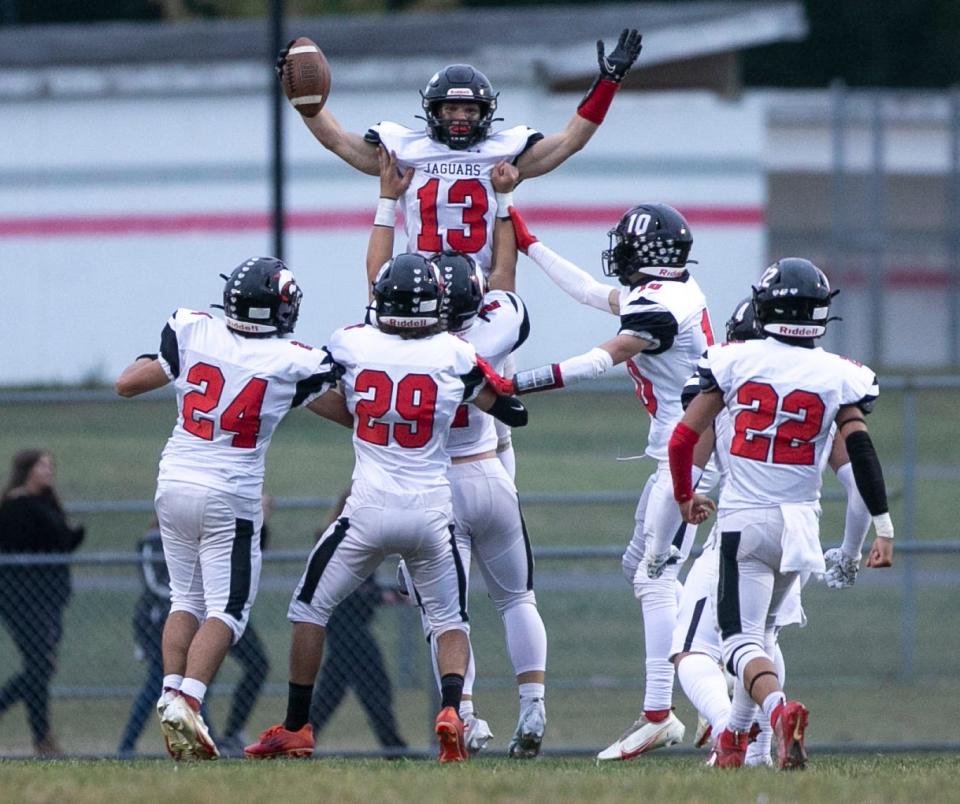 Jackson Memorial’s Ryan Jagodzinski celebrates a touchdown in the opening seconds of the game