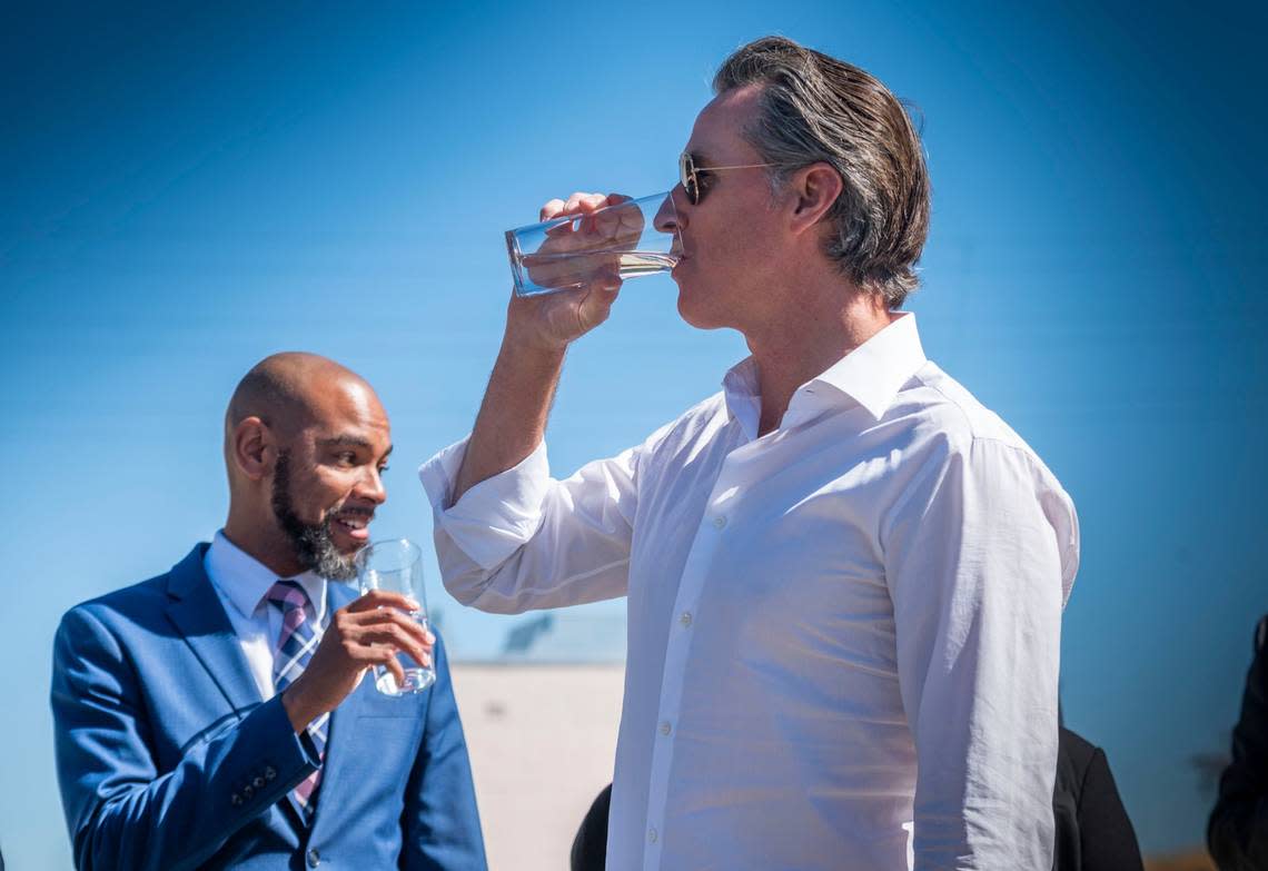 Gov. Gavin Newsom drinks water from the Antioch Water Treatment Plant with Antioch Mayor Lamar Thorpe on Thursday, Aug. 11, 2022, during an event where he announced a new water strategy for a hotter, drier California.