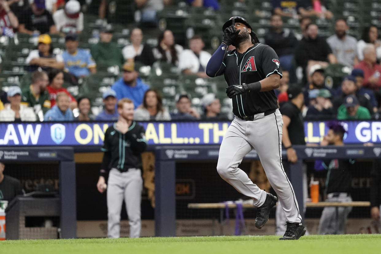 Arizona Diamondbacks' Josh Bell gestures after hitting a two-run home run during the third inning of a baseball game against the Milwaukee Brewers, Sunday, Sept. 22, 2024, in Milwaukee. (AP Photo/Aaron Gash)