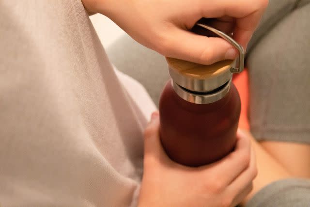 <p>Getty</p> Stock image of a child opening a water bottle