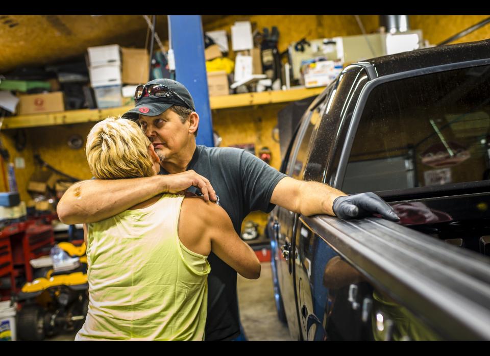  Beep takes a break from fixing cars and shares a powerful moment with Holley.