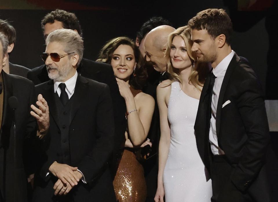 Aubrey stands among her costars on stage and Jon appears to be speaking to her