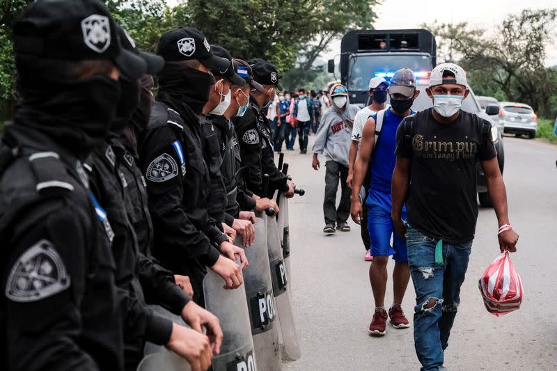 Hondurans take part in a new caravan of migrants, set to head to the United States, in San Pedro Sula