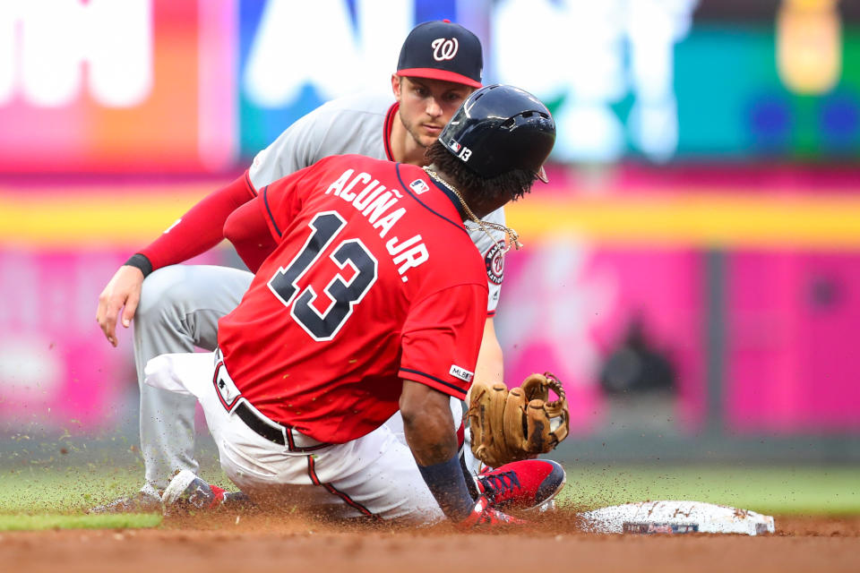 ATLANTA, GA - JULY 19: Ronald Acuna Jr. #13 of the Atlanta Braves is tagged out while attempting to steal second base by Trea Turner #7 of the Washington Nationals in the third inning during a game at SunTrust Park on July 19, 2019 in Atlanta, Georgia. (Photo by Carmen Mandato/Getty Images)