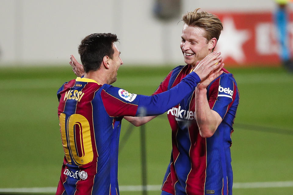 BARCELONA, SPAIN - APRIL 22: Lionel Messi of FC Barcelona celebrates scoring his side's 2nd goal with Frenkie De Jong of FC Barcelona during the La Liga Santander match between FC Barcelona and Getafe CF at Camp Nou on April 22, 2021 in Barcelona, Spain. Sporting stadiums around the UK remain under strict restrictions due to the Coronavirus Pandemic as Government social distancing laws prohibit fans inside venues resulting in games being played behind closed doors. (Photo by Eric Alonso/Getty Images)