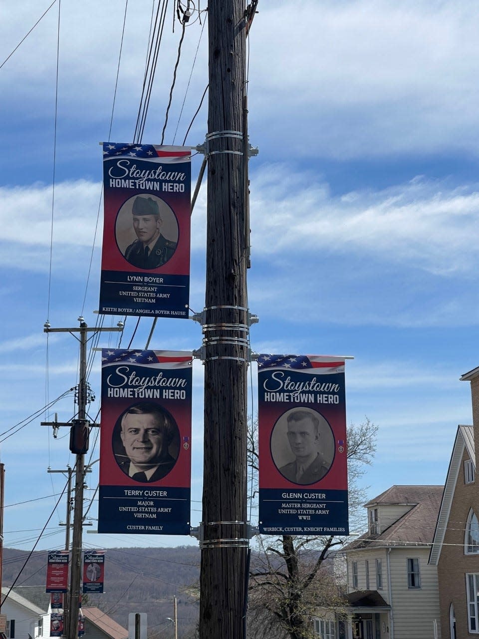 The banner of Lois Miller's brother, Lynn Boyer, top left, is one of several that her family sponsored to honor their family's veterans.