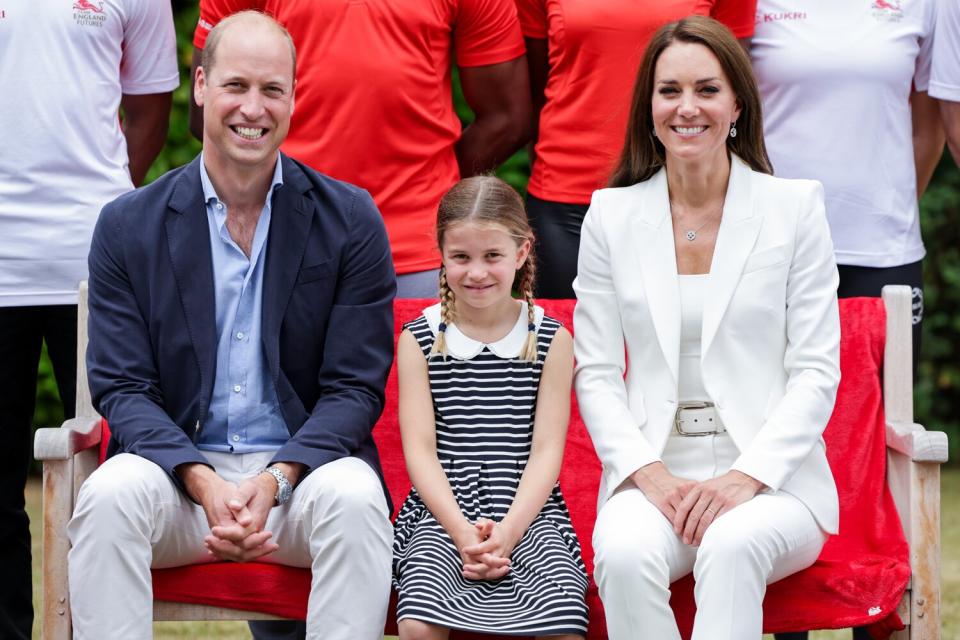 Prince William, Duke of Cambridge, Princess Charlotte of Cambridge and Catherine, Duchess of Cambridge smiling during a visit to SportsAid House at the 2022 Commonwealth Games