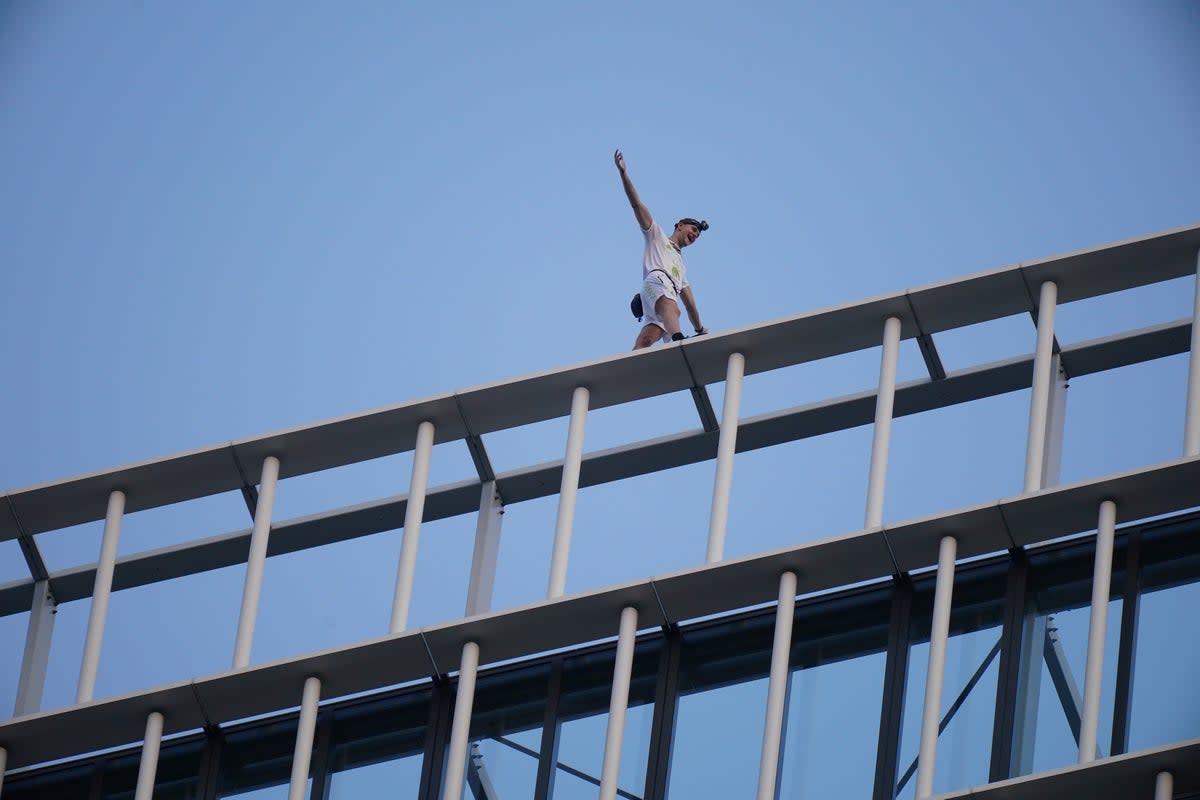 File: Free-solo climber George King-Thompson walks along the top of the Stratosphere Tower building, a 36-storey residential tower block in Stratford, east London  (PA Wire)