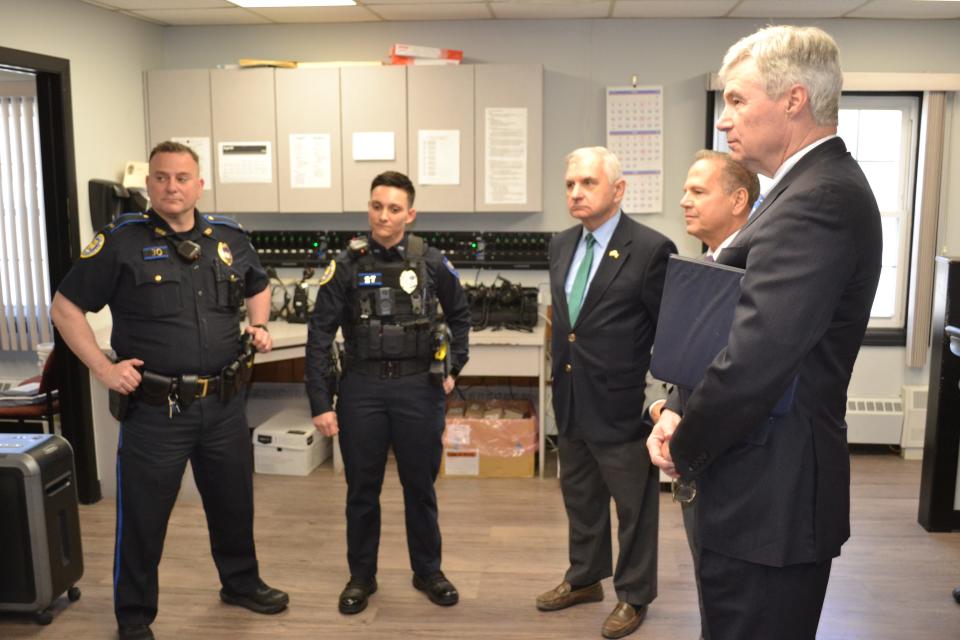 Lt. John LeDuc and Officer Jaqueline Smaldone lead Sen. Jack Reed, Rep. David Cicilline and Sen. Sheldon Whitehouse on a tour of the Tiverton Police Department.