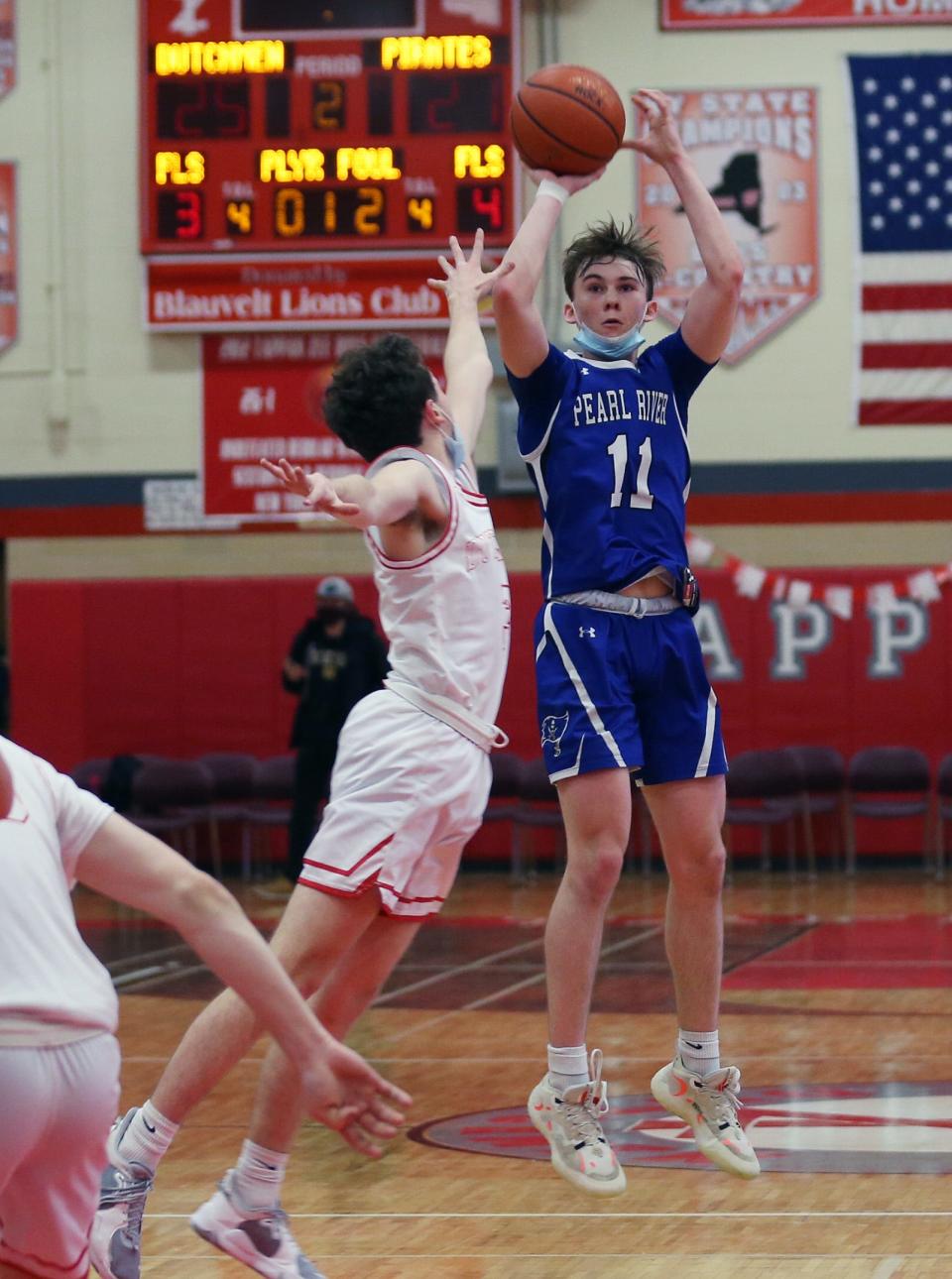 Pearl River's Jack Dwyer (11) puts up a shot in front of Tappan Zee's Colin Cunney (5) during boys basketball action at Tappan Zee High School Jan. 20, 2022. 