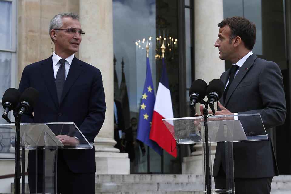 French President Emmanuel Macron, right, and NATO Secretary General Jens Stoltenberg deliver a statement to reporters Friday, May 21, 2021 after heir talks at the Elysee palace in Paris. (AP Photo/Francois Mori)