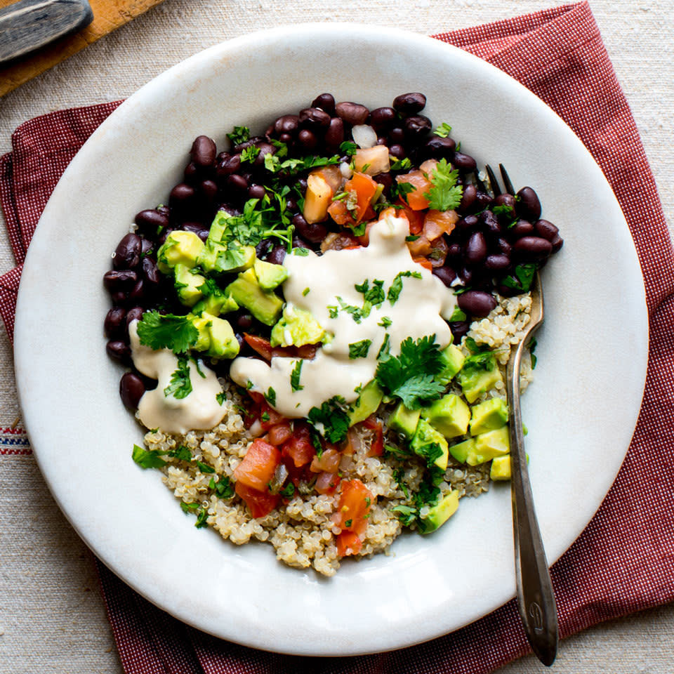 <p>This black bean and quinoa bowl has many of the usual hallmarks of a taco salad, minus the fried bowl. We've loaded it up with pico de gallo, fresh cilantro and avocado plus an easy hummus dressing to drizzle on top. <a href="https://www.eatingwell.com/recipe/260726/black-bean-quinoa-buddha-bowl/" rel="nofollow noopener" target="_blank" data-ylk="slk:View Recipe;elm:context_link;itc:0;sec:content-canvas" class="link ">View Recipe</a></p>