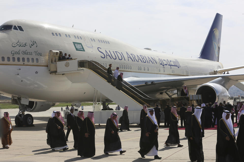 Saudi Arabia's King Salman, front descending from aircraft, arrives in Amman Jordan, Monday, March 27, 2017. Salman is in Jordan to attend the annual Arab Summit, to be held on Wednesday. Issues on the summit agenda include conflicts in Syria, Libya and Yemen. Saudi Arabia is an important financial backer of Jordan. (AP Photo/ Raad Adayleh)