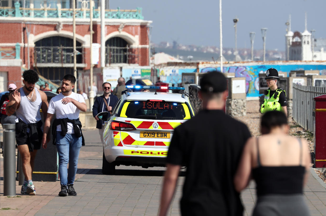 A police car patrols the promenade in Brighton as the UK continues in lockdown to help curb the spread of the coronavirus.as the UK continues in lockdown to help curb the spread of the coronavirus.