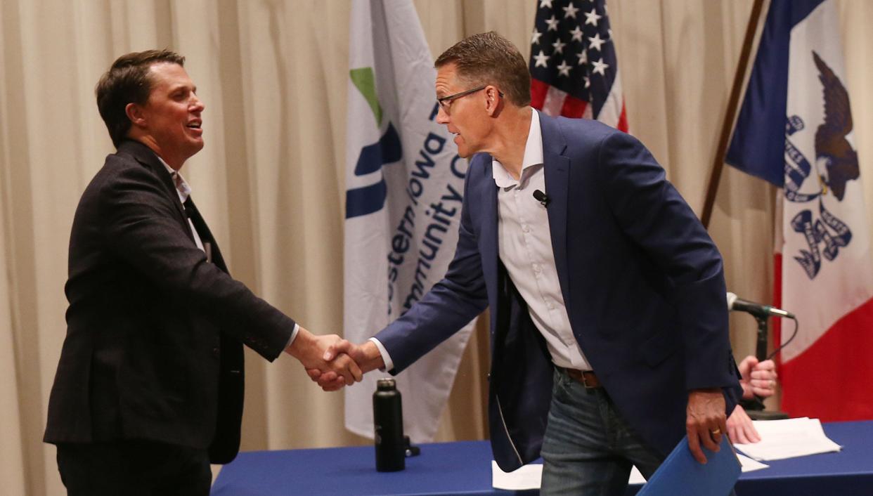 Iowa 4th district GOP candidates Rep. Randy Feenstra and challenger Kevin Virgil (left) hand sake after a candidate forum at Western Iowa Tech Community College on Thursday, May 30, 2024, in Cherokee, Iowa.