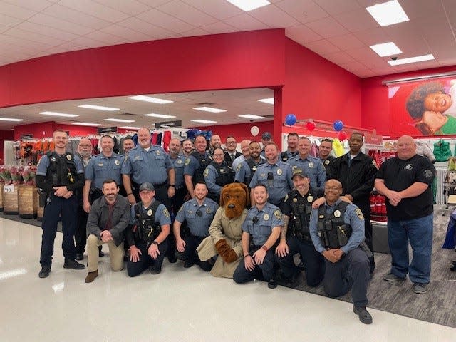 Members of the Lawton Police Department of Oklahoma take to their local Target to sponsor less-privileged children in the purchasing of gifts for Christmas each year.