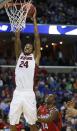 Stanford forward Josh Huestis (24) dunks on Dayton guard Jordan Sibert (24) during the first half in a regional semifinal game at the NCAA college basketball tournament, Thursday, March 27, 2014, in Memphis, Tenn. (AP Photo/John Bazemore)