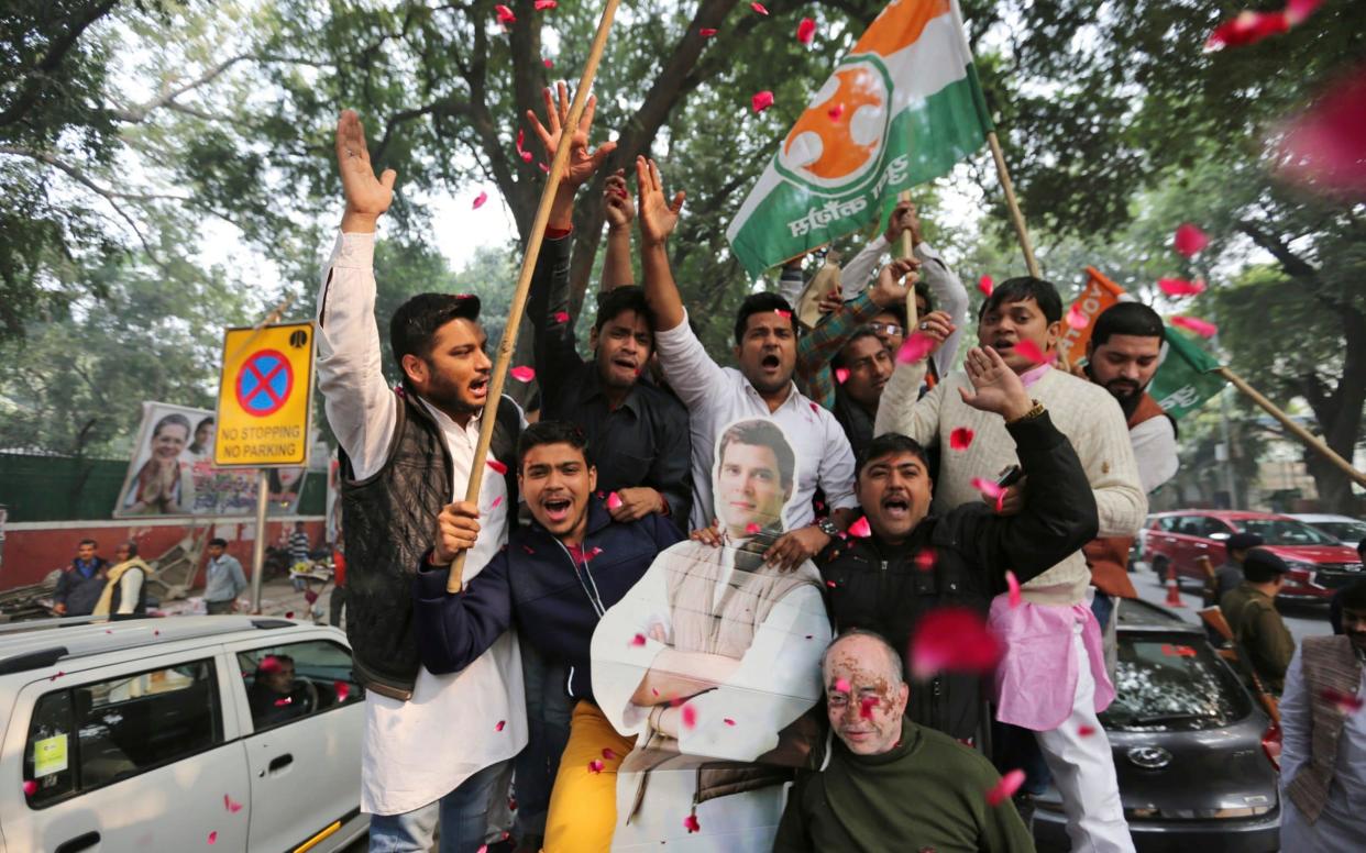 Congress party supporters celebrate victories in the states of Chhatisgarh and Rajasthan - AP