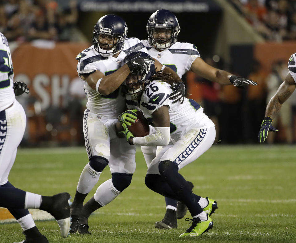 Seattle Seahawks cornerback Shaquill Griffin (26) intercepts a pass during the first half of an NFL football game against the Chicago Bears Monday, Sept. 17, 2018, in Chicago. (AP Photo/Nam Y. Huh)