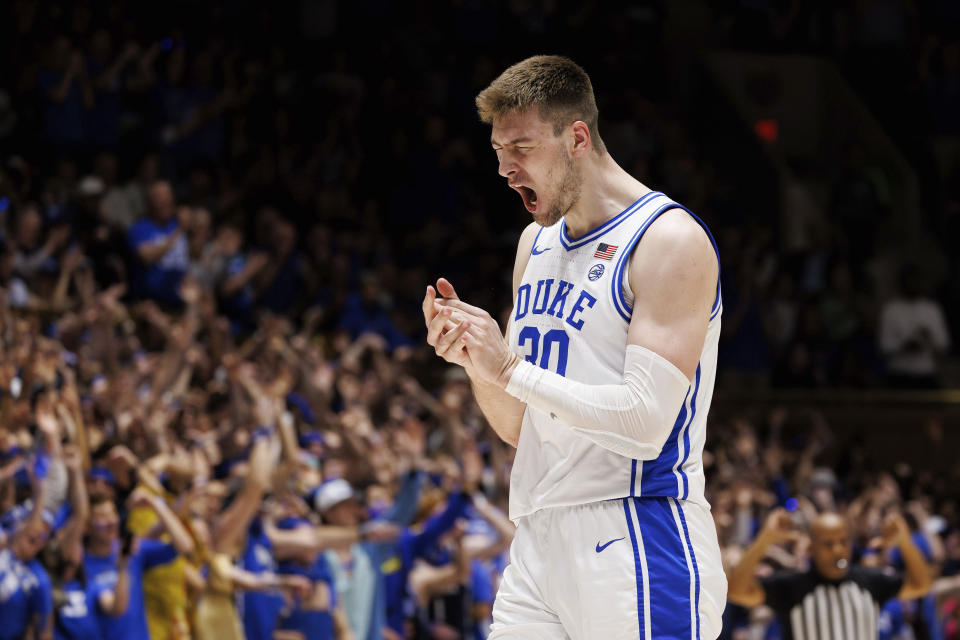 Duke's Kyle Filipowski (30) reacts after hitting a three-point shot during the first half of an NCAA college basketball game against Virginia in Durham, N.C., Saturday, Mar. 2, 2024. (AP Photo/Ben McKeown)