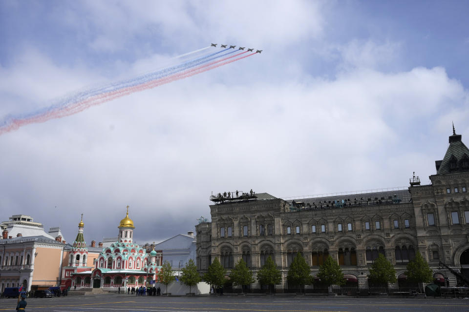 Russian Air Force Su-25 jets fly over Red Square leaving trails of smoke in colours of the national flag during the Victory Day military parade in Moscow, Russia, Thursday, May 9, 2024, marking the 79th anniversary of the end of World War II. (AP Photo/Alexander Zemlianichenko)