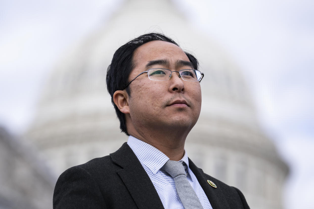 Representative Andy Kim stands outside the U.S. Capitol during a news conference.
