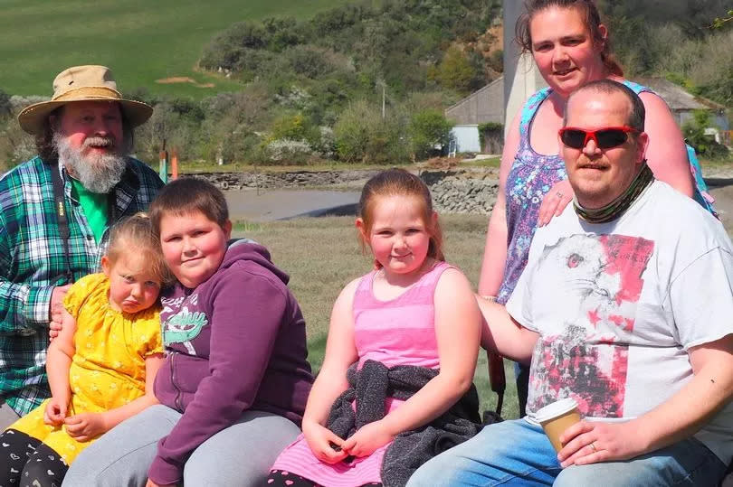 Tara Luscombe and her family, including Sue Ellery-Hill's husband Chris. She, husband Jan and their three children are the victims of a 'no fault' eviction for the second time in two years