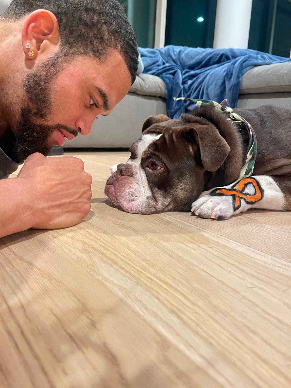 USC quarterback Caleb Williams and his dog Supa.