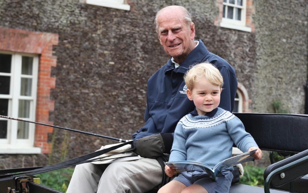 Prince Philip, the Duke of Edinburgh is seen with Prince George in this undated handout photograph made available Monday 12th April, 2021. - Duchess of Cambridge/Royal Family