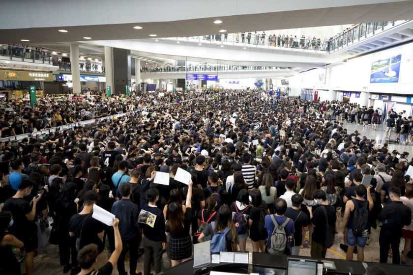 Protesters demonstrate at the airport in Hong Kong on Monday.