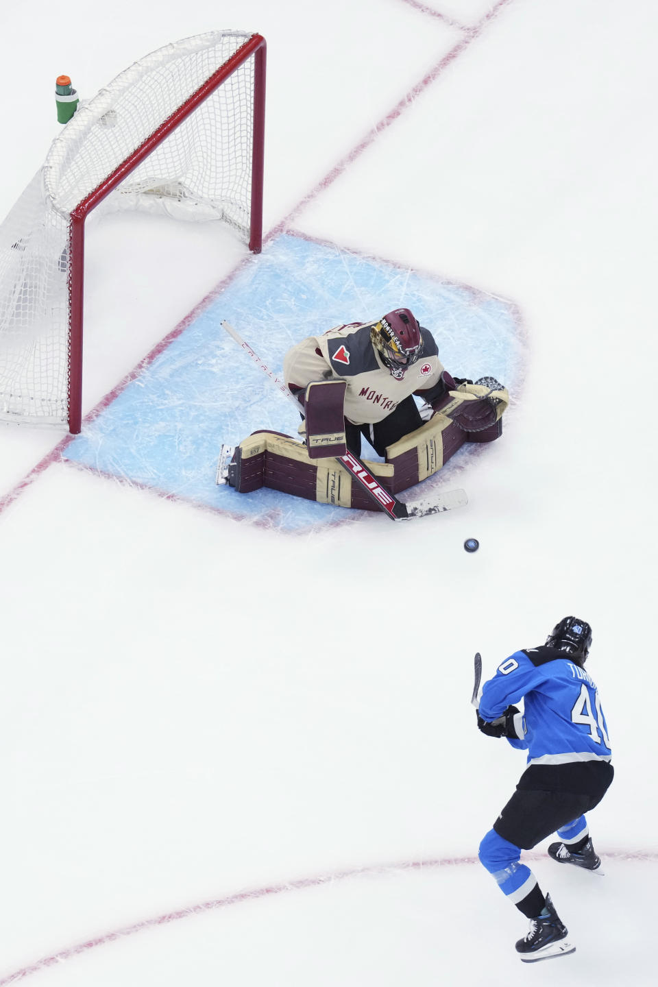 Toronto's Blayre Turnbull shoots on Montreal goaltender Ann-Renee Desbiens during the first period of a PWHL hockey game Friday, Feb. 16, 2024, in Toronto. (Chris Young/The Canadian Press via AP)