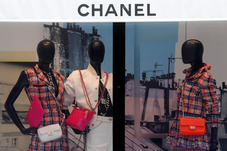 Chanel bags in the window of a Chanel store in Paris. Husein authenticates hundreds of handbags a week, studying the leather, the stitching, the hardware and the serial number. She says about one out of every five bags she inspects is counterfeit. 