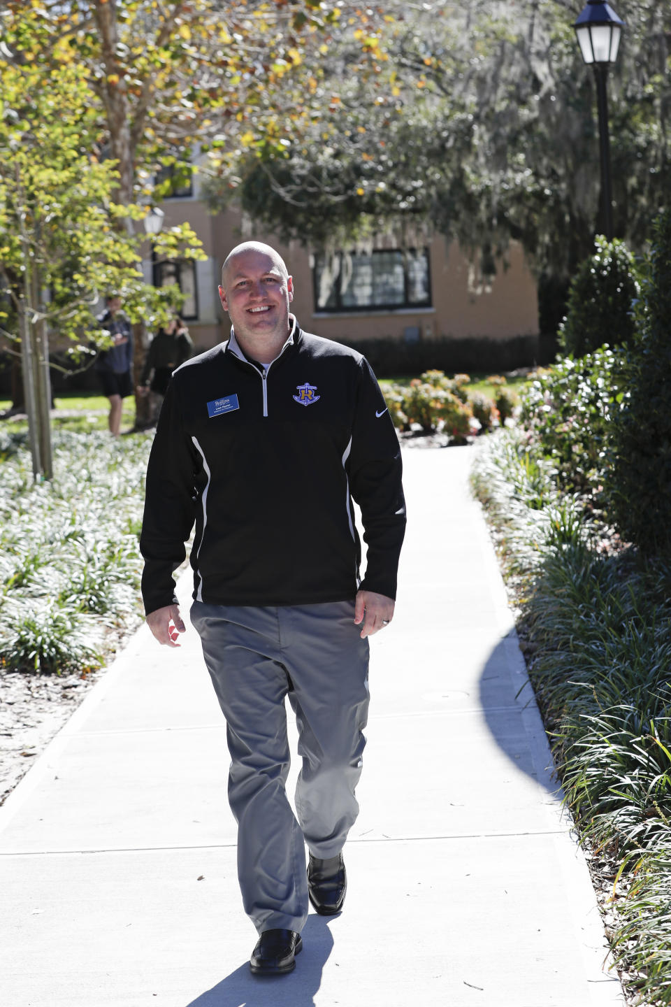 In this Tuesday, Jan. 28, 2020 photo, Leon Hayner, an associate dean of students at Rollins College walks on the campus in Winter Park, Fla. Because of the federal privacy law, university administrators, if called upon, won't be able to disclose students' sex, race or Hispanic origin on the 2020 Census form. (AP Photo/John Raoux)