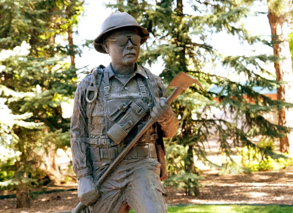 A statue for firefighter Richard "Rick" Glenn Lupe is outside the Pinetop library on U.S. 260. Richard "Rick" Glenn Lupe died battling a a forest fire in 2003 near Pinetop-Lakeside.