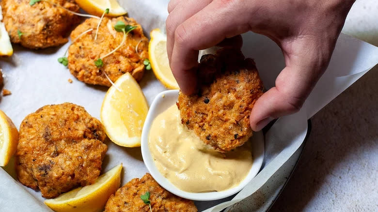 Salmon patties dipped in aioli