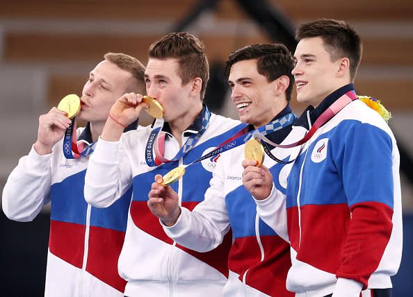 ROC athletes awarded gold medals during the victory ceremony after the men's artistic gymnastics final team all-around event held at the Ariake Gymnastics Centre as part of the 2020 Summer Olympic Games.