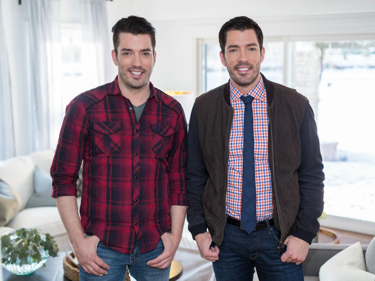 Jonathan and Drew Scott smile for a photo.