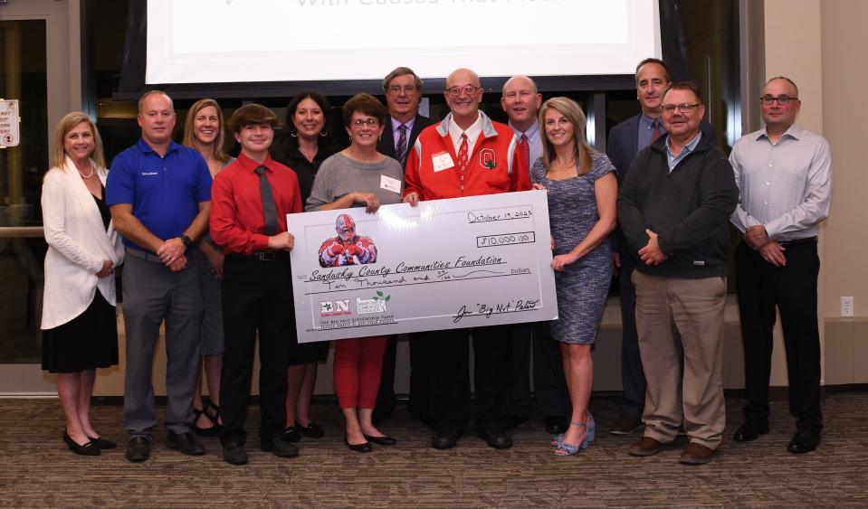 Jon Paul and Terese Marie Peters, presented a $10,000 check toward teh Big Nut Scholarship to the Sandusky County Communities Foundation board.