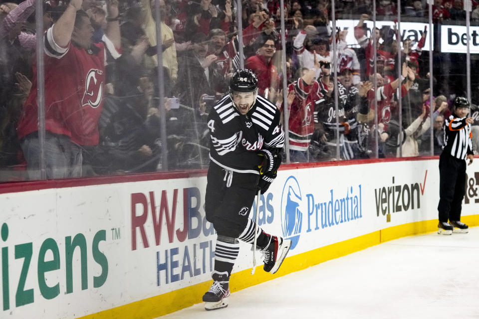 New Jersey Devils left wing Miles Wood (44) celebrates after scoring on Buffalo Sabres goaltender Devon Levi during the second period of an NHL hockey game, Tuesday, April 11, 2023, in Newark, N.J. (AP Photo/John Minchillo)