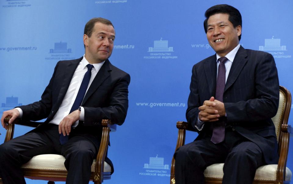 Li Hui, China's special representative for Eurasian affairs, (R) sat with Russian Prime Minister Dmitry Medvedev (L) during his time as ambassador to Moscow in 2015. - RIA Novosti/REUTERS