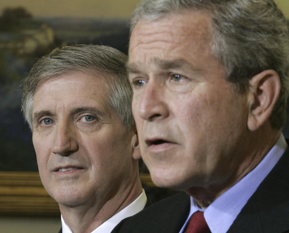 FILE - Outgoing White House chief of staff Andy Card, left, looks on as President George W. Bush speaks in the Oval Office of the White House March 28, 2006, in Washington. (AP Photo/Charles Dharapak, File)