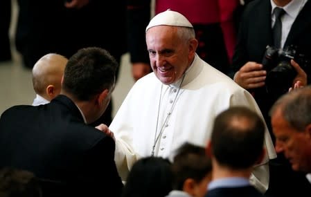 Pope Francis is greeted as he leads a special audience with members of the Neocatechumenal Way in Paul VI hall at the Vatican March 18, 2016. REUTERS/Tony Gentile