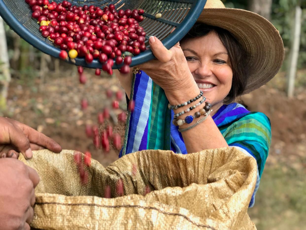 Heidi Kühn of California works in Jalapa, Guatemala, to harvest coffee beans. She received the World Food Prize Thursday at the Iowa Capitol for her work to turn minefields into productive farmland.