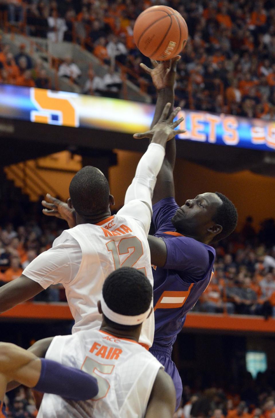 Clemson's Sidy Djitte shoots over Syracuse's Baye Moussa Keita during the first half of an NCAA college basketball game in Syracuse, N.Y., Sunday, Feb. 9, 2014. (AP Photo/Kevin Rivoli)